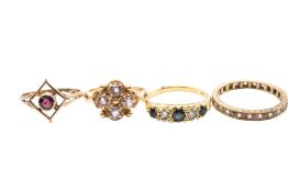 A collection of four yellow gold and gem set rings
