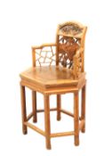 A SMALL CHINESE CARVED CHAIR