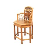 A SMALL CHINESE CARVED CHAIR