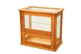 AN OAK COUNTER-TOP DISPLAY CABINET