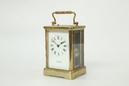 A FRENCH BRASS CASED CARRIAGE CLOCK WITH PUSH BUTTON REPEAT