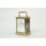 A FRENCH BRASS CASED CARRIAGE CLOCK WITH PUSH BUTTON REPEAT