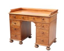 A MID VICTORIAN MAHOGANY DESK, PROBABLY BY GILLOWS