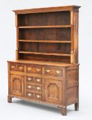 AN INLAID OAK DRESSER AND RACK, NORTH WALES, EARLY 19TH CENTURY