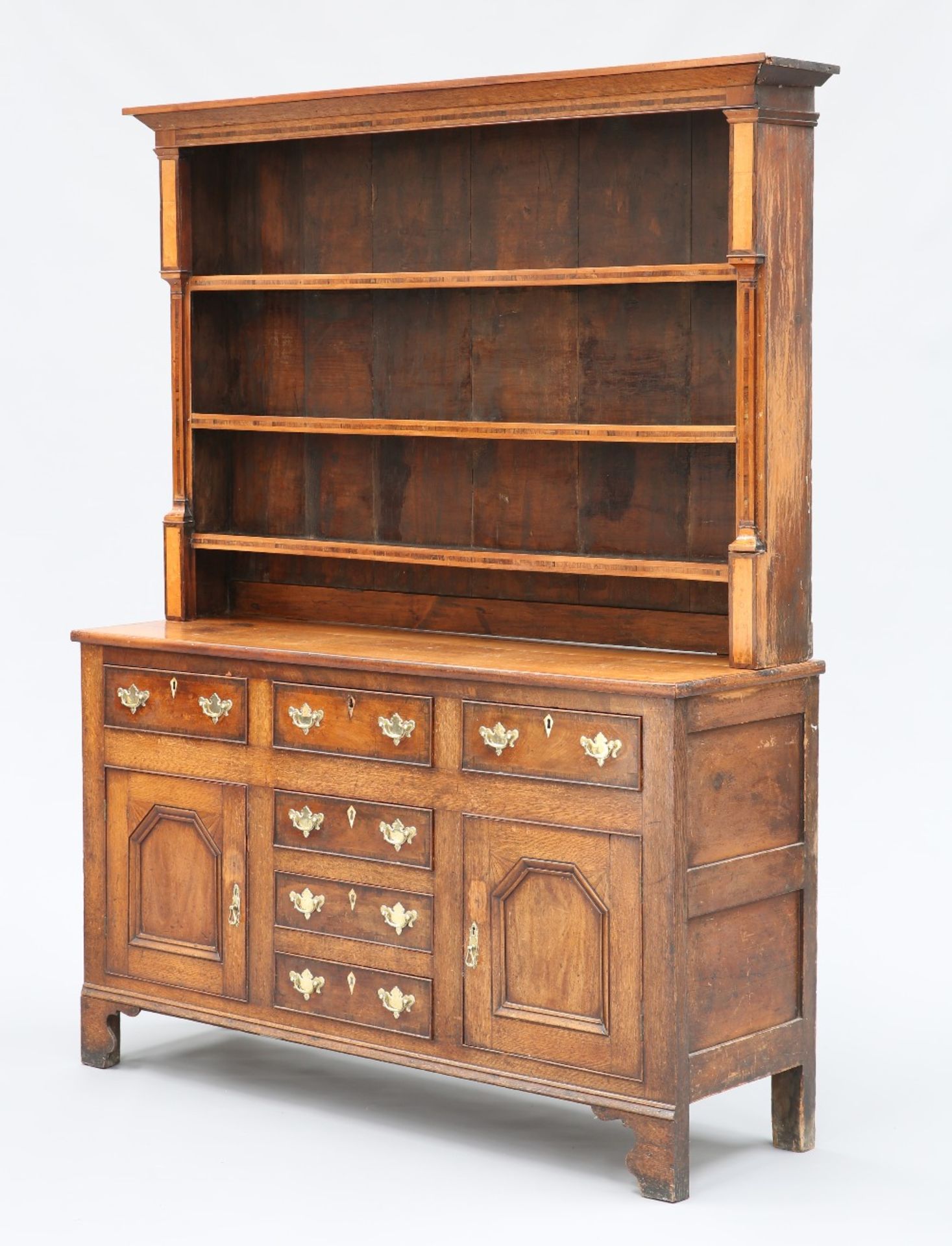 AN INLAID OAK DRESSER AND RACK, NORTH WALES, EARLY 19TH CENTURY