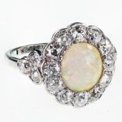 AN 18CT WHITE GOLD AND PLATINUM OPAL AND DIAMOND CLUSTER RING