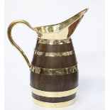 A LARGE POLISHED BRASS AND COOPERED OAK JUG