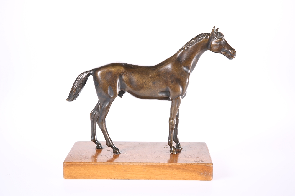 A BRONZE MODEL OF A HORSE