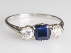 A SAPPHIRE AND DIAMOND RING