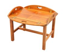 A TEAK BUTLER'S TRAY COFFEE TABLE