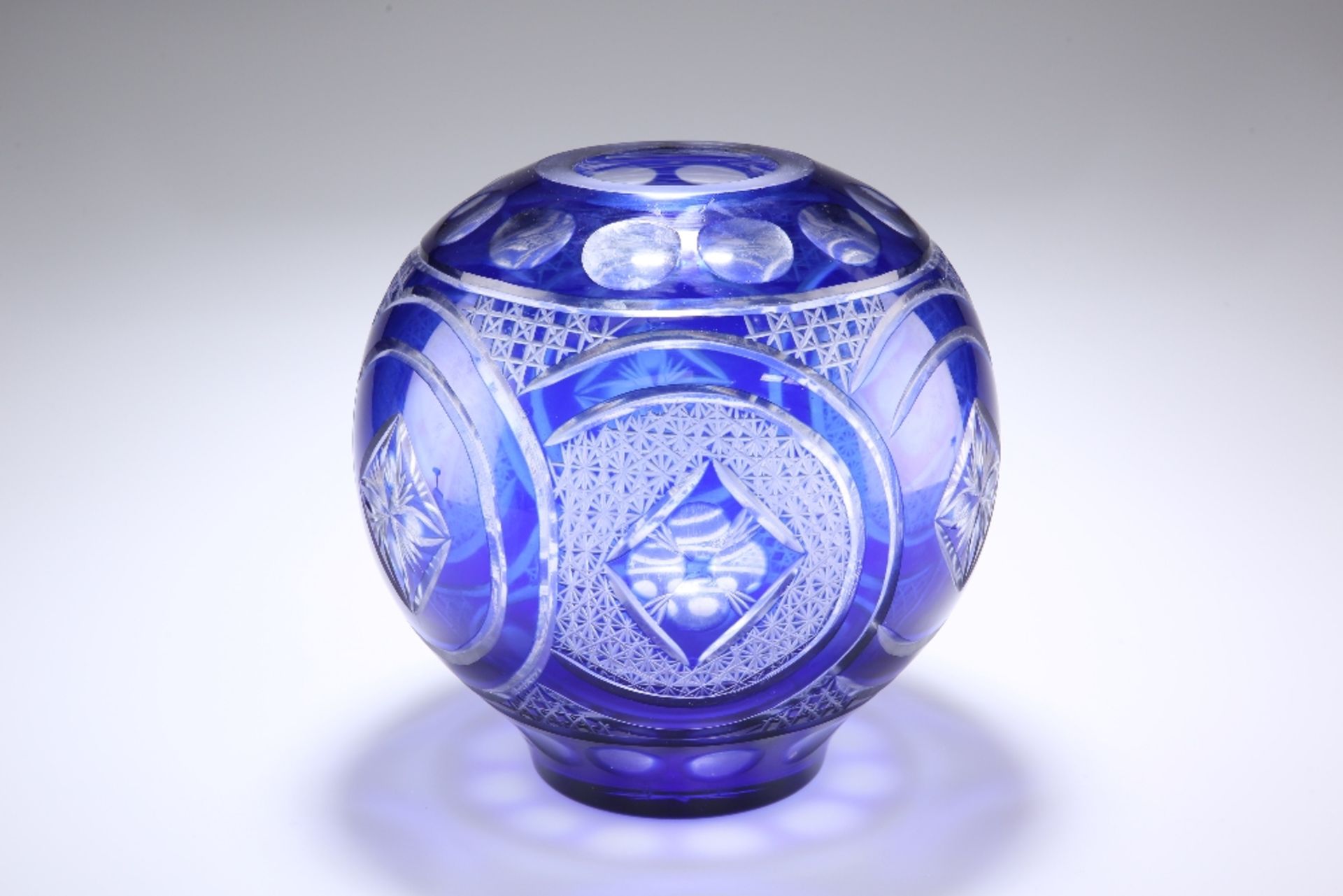 A LARGE BOHEMIAN BLUE OVERLAY GLASS VASE