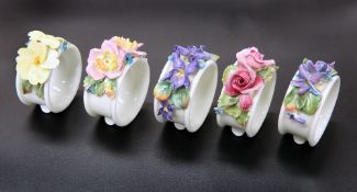 A SET OF FIVE ROYAL DOULTON NAPKIN RINGS, CIRCA 1920'S