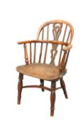 AN EARLY 19TH CENTURY CHILD'S YEW WOOD WINDSOR CHAIR