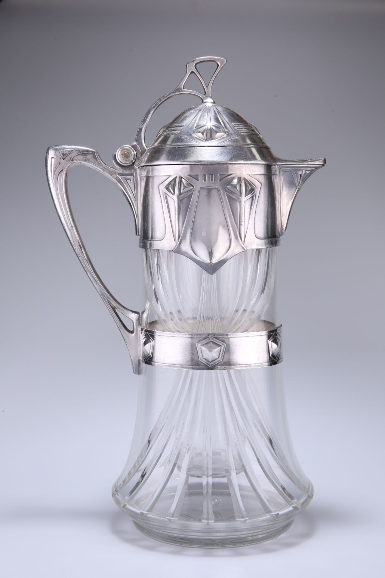 A LARGE JUGENDSTIL SILVER-PLATE MOUNTED CUT-GLASS ICED WATER JUG