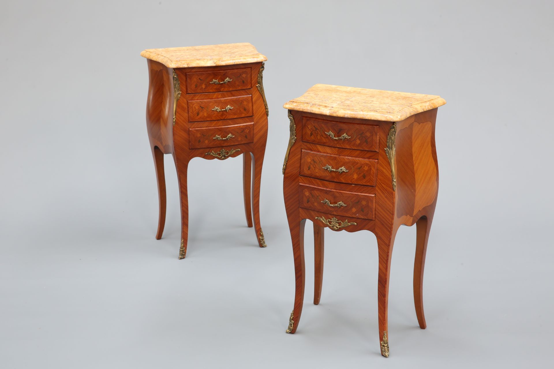 A PAIR OF LOUIS XV STYLE GILT-METAL MOUNTED, MARBLE-TOPPED AND FLORAL MARQUETRY BEDSIDE TABLES