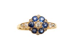 A SAPPHIRE AND DIAMOND CLUSTER RING, CIRCA 1923