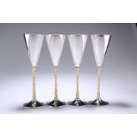 A SET OF FOUR ELIZABETH II PARCEL-GILT SILVER CHAMPAGNE FLUTES