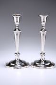 A PAIR OF GEORGE V SILVER CANDLESTICKS