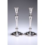 A PAIR OF GEORGE V SILVER CANDLESTICKS