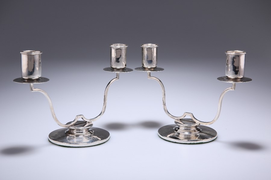 A PAIR OF GEORGE VI SILVER TWO-LIGHT CANDELABRA