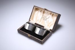 A PAIR OF GEORGE V SILVER NAPKIN RINGS