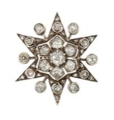 A DIAMOND STAR BROOCH