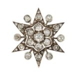 A DIAMOND STAR BROOCH