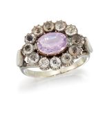 AN AMETHYST AND PASTE CLUSTER RING