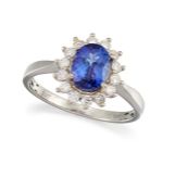 A TANZANITE AND DIAMOND CLUSTER RING