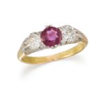 AN EARLY 20TH CENTURY RUBY AND DIAMOND THREE-STONE RING, BY WILLIAM GREENWOOD & SONS