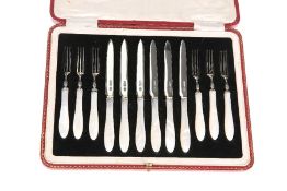 A SET OF SIX GEORGE V SILVER AND MOTHER-OF-PEARL HANDLED FRUIT KNIVES AND FORKS