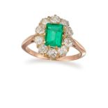 AN EMERALD AND DIAMOND CLUSTER RING