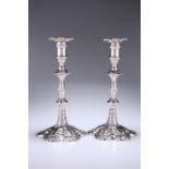 A PAIR OF GEORGE III CAST SILVER CANDLESTICKS