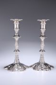 A PAIR OF GEORGE III CAST SILVER CANDLESTICKS