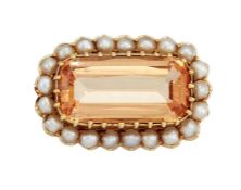 A TOPAZ AND HALF PEARL BROOCH