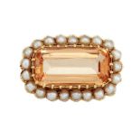 A TOPAZ AND HALF PEARL BROOCH