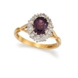 A PURPLE SAPPHIRE AND DIAMOND CLUSTER RING