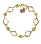 A PERIDOT AND SEED PEARL BRACELET