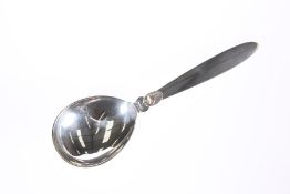 AN ART DECO SILVER SERVING SPOON