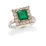 AN EMERALD AND DIAMOND CLUSTER RING