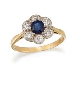 A SAPPHIRE AND DIAMOND CLUSTER RING