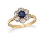 A SAPPHIRE AND DIAMOND CLUSTER RING