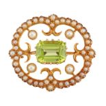 A PERIDOT AND SEED PEARL BROOCH