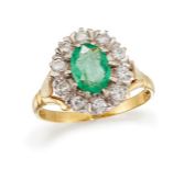 AN EMERALD AND DIAMOND CLUSTER RING