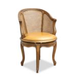 A LOUIS XV STYLE BEECH AND CANEWORK SWIVEL DESK CHAIR