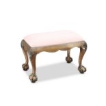 A CHIPPENDALE STYLE MAHOGANY STOOL, with ball and claw feet