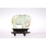 A CHINESE CARVED JADE MODEL OF AN ELEPHANT,