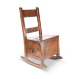 AN 18TH CENTURY OAK CHILD'S ROCKING CHAIR