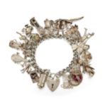 A SILVER CHARM BRACELET, the bracelet hallmarked London 1977