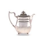 A GEORGE III SILVER HOT WATER JUG, by William Bennett